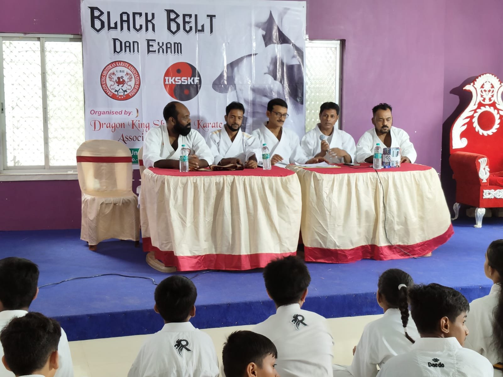 The panel of national examiners at the table during the Black Belt Dan Exam