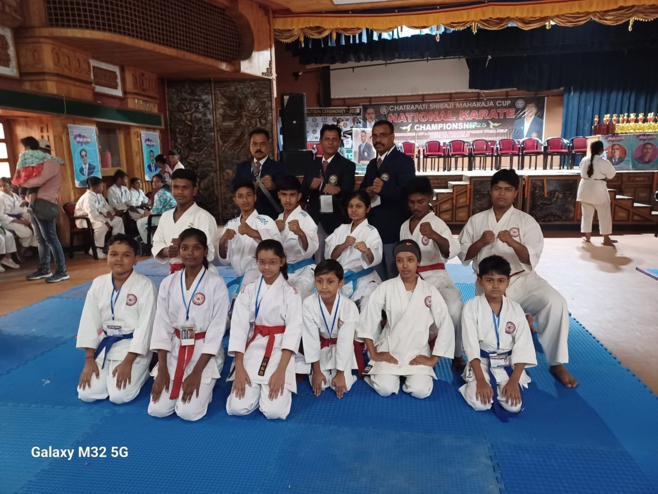 DKSKA competitors and officials on stage at the Chatrapati Shivaji Maharaj Cup National Karate Championship