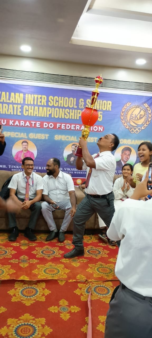 Celebrating a trophy win at the Kalam Inter School and Senior Karate Championship