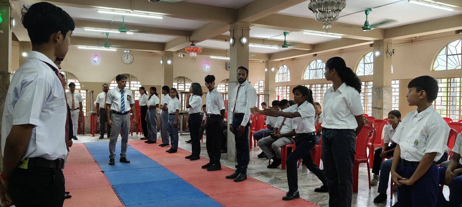 An instructor guiding students through seminar drills