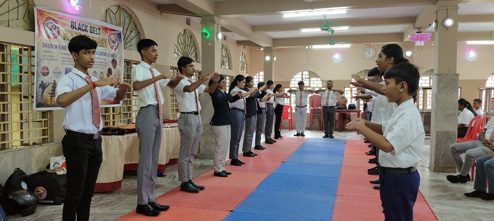 Students practising a hand technique drill, facing off in pairs